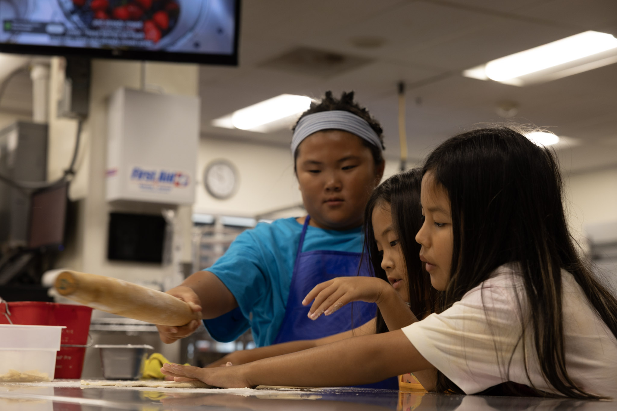 Students rolling dough during a Food for Thought lesson